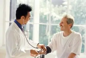 Doc checking Blood Pressure