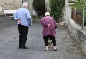 Elderly parents walking outside